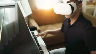 A beginner musician learns how to play the piano through augmented reality