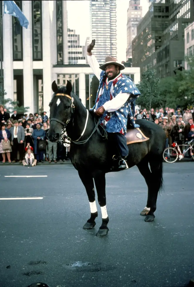Luciano Pavarotti rides a horse down New York’s 5th Avenue, leading the 1980 Columbus Day Parade.