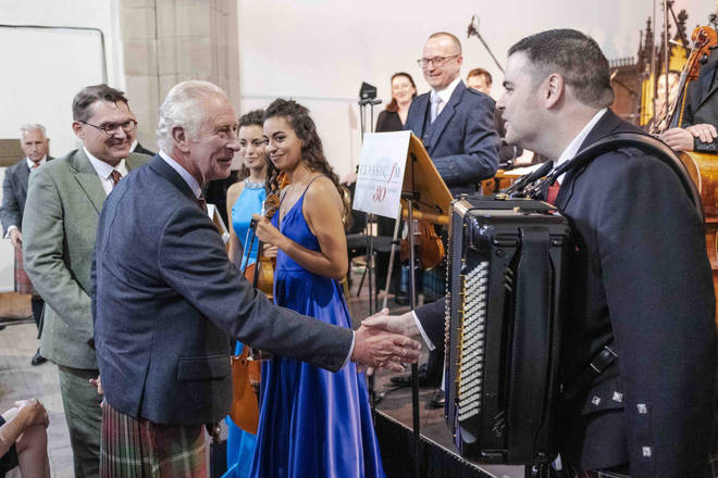 HRH The Prince Charles, Duke of Rothesay, shakes the hand of champion accordionist, Liam Stewart.