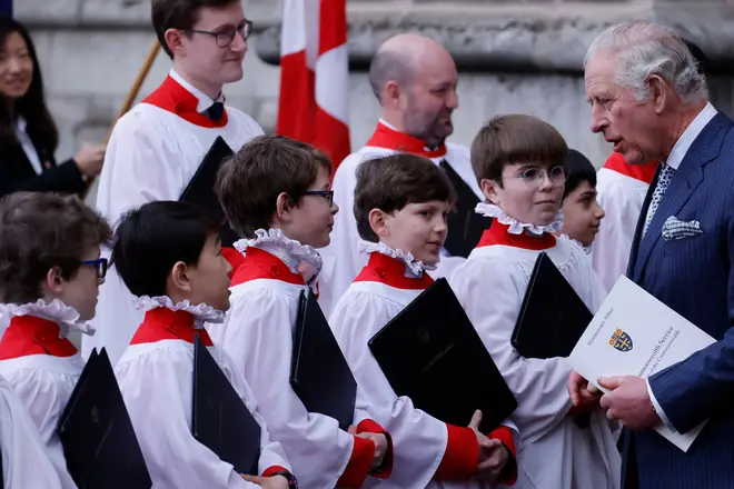 King Charles III speaks with members of the Westminster Abbey Choir