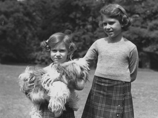 Princess Margaret (left) and Queen Elizabeth II (right) as young girls, with pet Cairngorm terrier, Chu-Chu.
