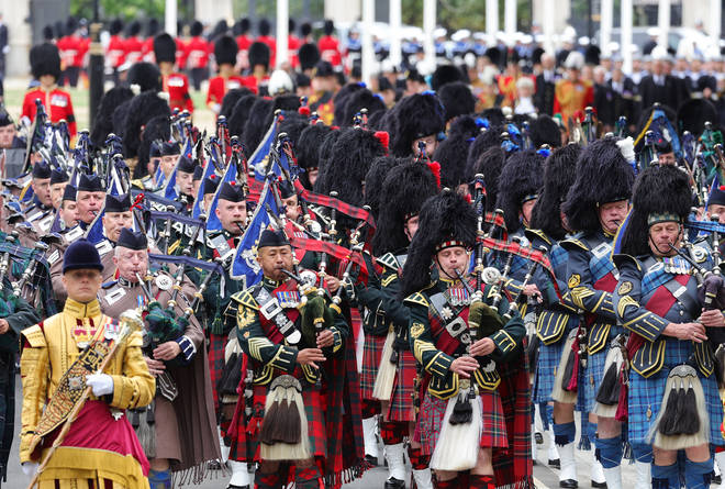 Massed Pipes & Drums of Scottish and Irish Regiments play outside Westminster Abbey during The State Funeral of Queen Elizabeth II