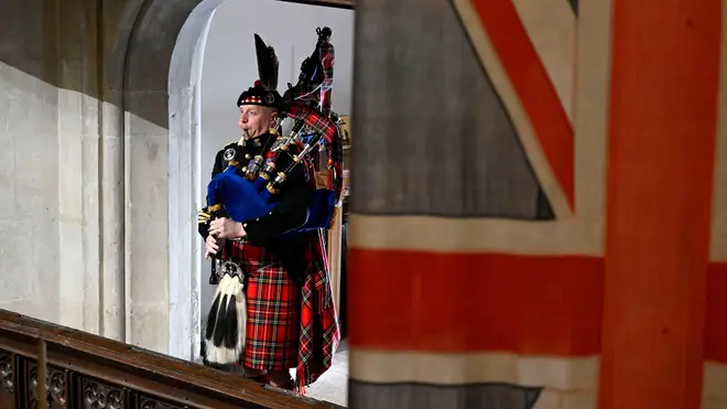 Pipe Major Paul Burns of the Royal Regiment of Scotland plays the State Funeral of Queen Elizabeth II at Westminster Abbey,