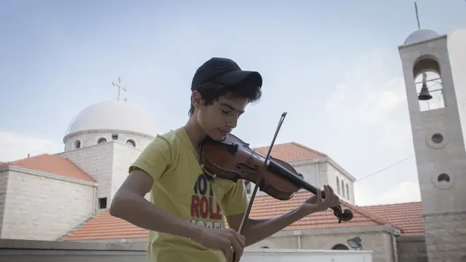 Aboud Kaplo plays the violin