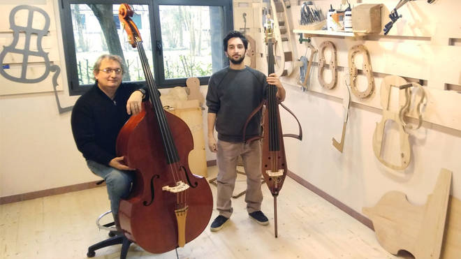 Full-size double bass, next to a TravelBass