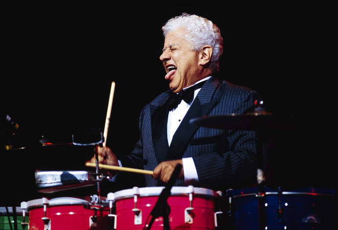Tito Puente plays timbales at a concert.