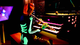 Andrea Fisher performs ‘Danse Macabre’ on flute and organ