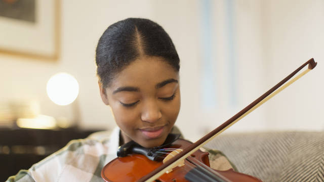 Teenage girl playing the violin
