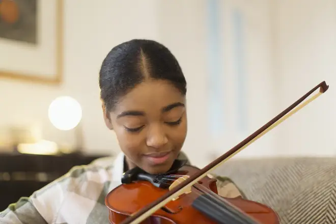 Teenage girl playing the violin