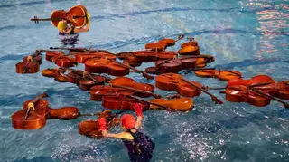 30 cellos in a swimming pool