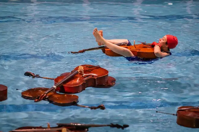 Cellos in a swimming pool