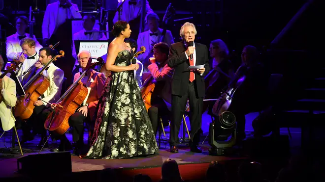 Classic FM Presenters Margherita Taylor and John Suchet on stage at the Royal Albert Hall