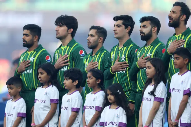Members of the Pakistan cricket team sing their national anthem.