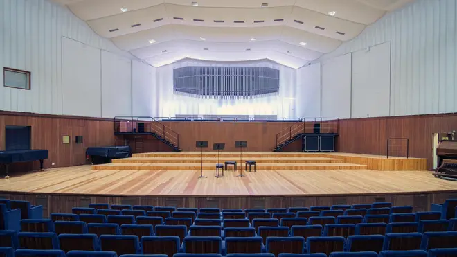 An empty concert hall stage at the Conservatorio in Milan