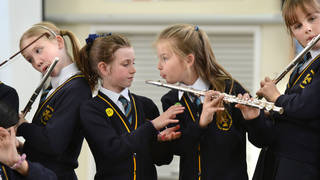 Young flutists during a music lesson Our Lady & St. Werburgh's Catholic Primary School in Newcastle-under-Lyme, Staffordshire UK