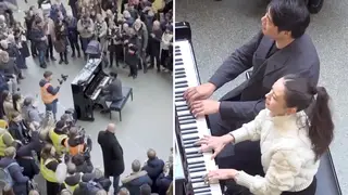 Lang Lang and Gina Alice Redlinger play a piano duet at St Pancras station in London