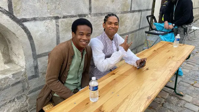 Ronald Long and Kelvin Harrison Jr. take a break on set