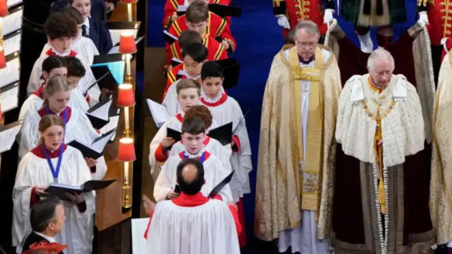 The girl choristers of Truro Cathedral (left) sing alongside the boy choristers of Westminster Abbey at the coronation of King Charles III