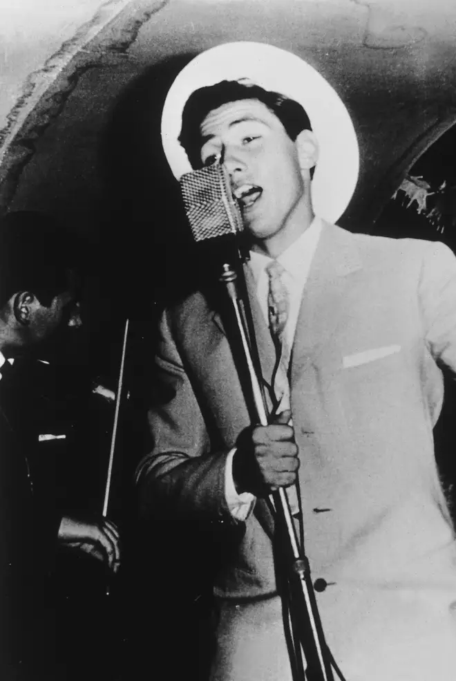 A young Berlusconi sings on a cruise ship in the 1960s