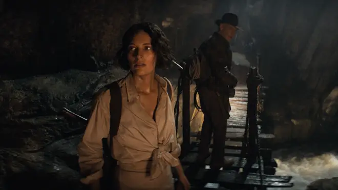 Helena Shaw and Indiana Jones enter the cave on their way to find the tomb or Archimedes