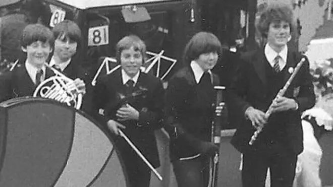 Sir Keir playing with a wind quintet at a Duke of Edinburgh Awards with hair he commented he would “not be sporting now”