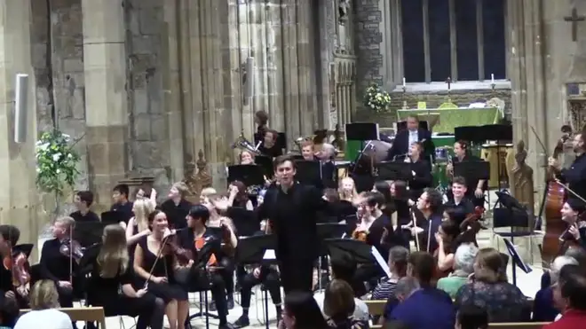 John Lyon conducts orchestra at Sheffield Cathedral