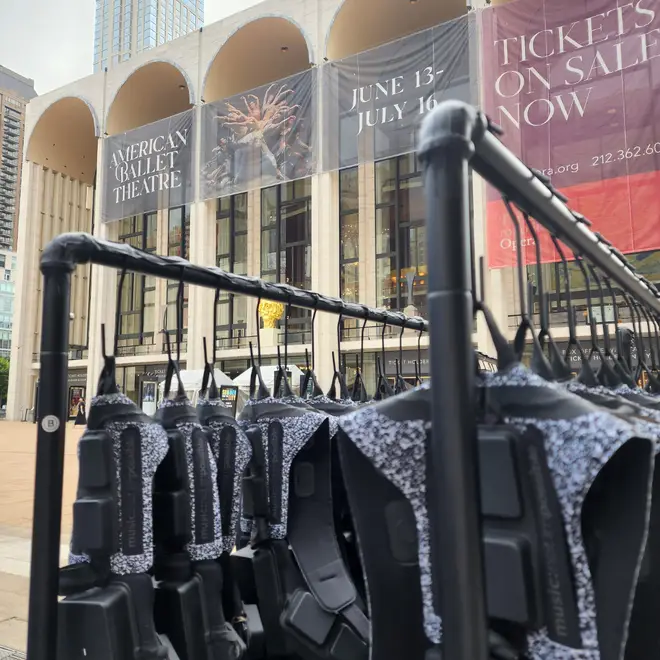 A rail of M:NI technology sits on rails outside of the New York Metropolitan Opera House