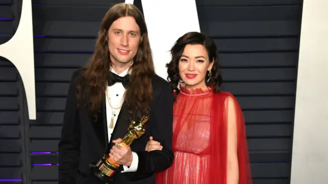Ludwig Göransson and his wife, violinist Serena McKinney pose on the red carpet following Göransson’s win for Best Original Score at the 91st Academy Awards