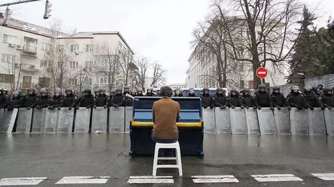 A pianist plays in front of a blockade in Kyiv in 2013.