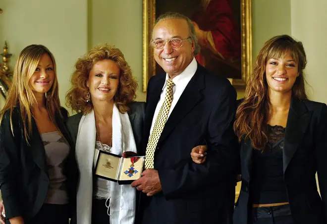 Nicola stands with her father Giovanni, her sister Stephanie, and her mother Francesca Benedetti