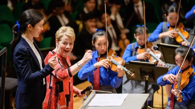 Marin Alsop leads a masterclass in Hong Kong at the Diocesan Girls School.