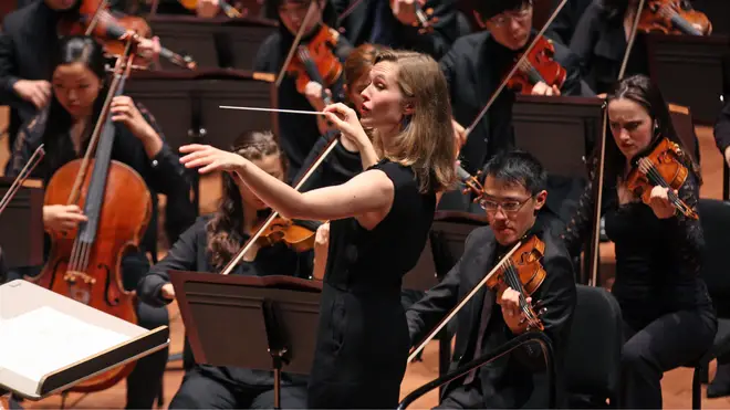 Why do orchestras usually perform in black? (pictured: conductor Mirga Gražinytė-Tyla)