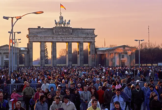 West German citizens flock to the Brandenburg Gate on Christmas after the fall of the Berlin Wall.
