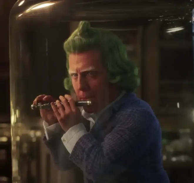 Hugh Grant portrays a piccolo-playing Oompa Loompa in the new Wonka film starring Timothée Chalamet.