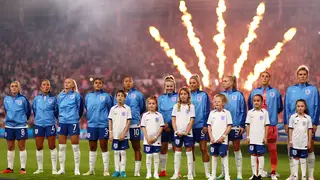 England’s Lionesses stand for the national anthem ahead of a match against Scotland in the UEFA Women’s League.