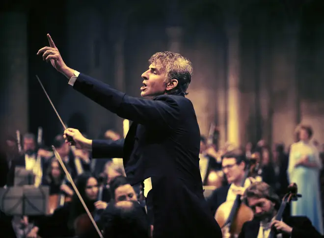 Bradley Cooper as Leonard Bernstein, conducting a live symphony orchestra