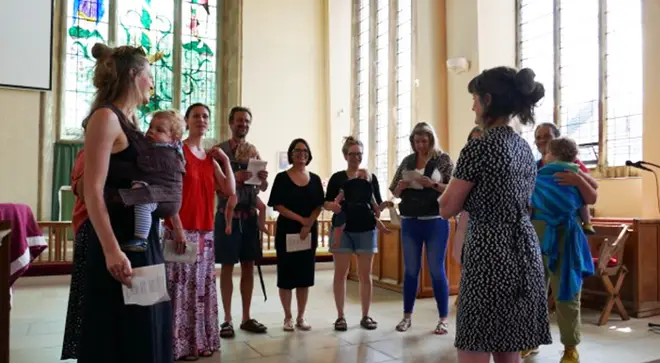 Mums sing with their babies during a Folks and Bairns choir rehearsal