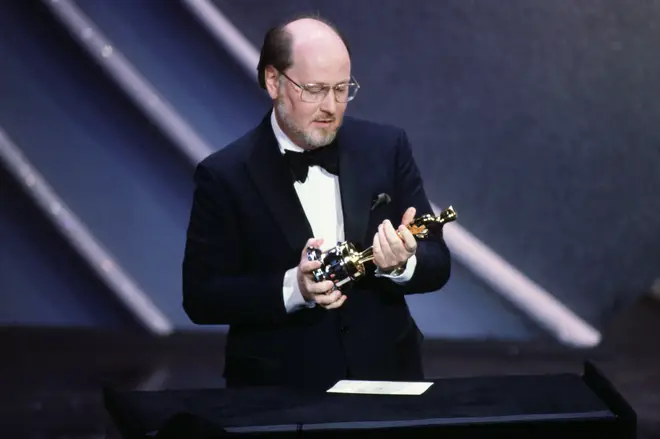 John Williams holds his Oscar gong for 'E.T'