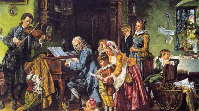 J.S. Bach and his family gather round the keyboard in an 1870 portrait.