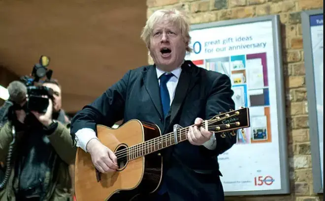 Boris Johnson 'plays' guitar