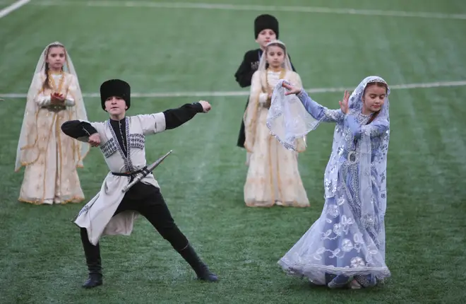 Children from a traditional Chechen dance group perform ahead of a football match in the region’s capital Grozny.