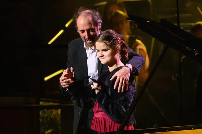 Lucy takes a bow with her teacher Daniel at Classic FM Live (October 2023)