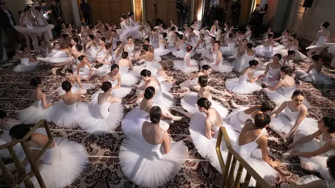 The ballet dancers enjoy some down time, as they gather to set a new world record for Most Ballet Dancers En Pointe Simultaneously.