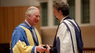 King Charles presents opera star Jonas Kaufmann with an honorary Doctor of Music award at the Royal College of Music