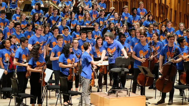 Gustavo Dudamel and young musicians at Tuning into Change