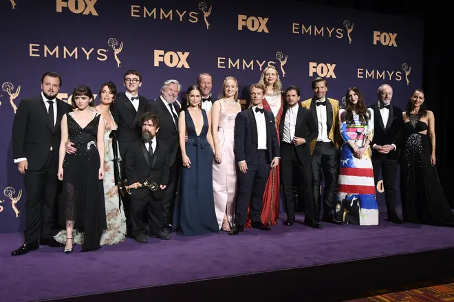 'Game of Thrones' cast and crew pose with awards for Outstanding Drama Series at 71st Emmy Awards.