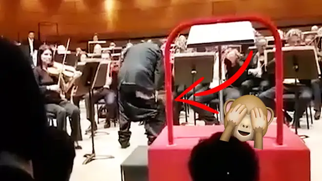 Muhai Tang’s trousers fall to his knees during a performance