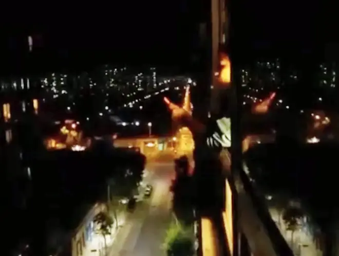 Chilean opera singer Ayleen Jovita Romero performs from her bedroom window