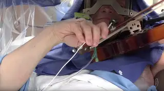 Playing violin during surgery